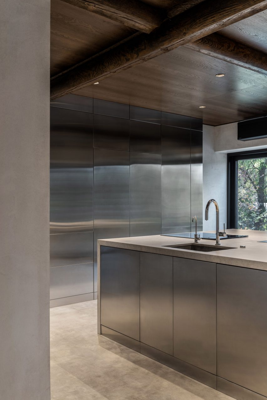 Photograph of concrete and stainless steel kitchen