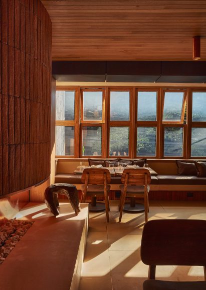A wall of wood-framed windows in a restaurant