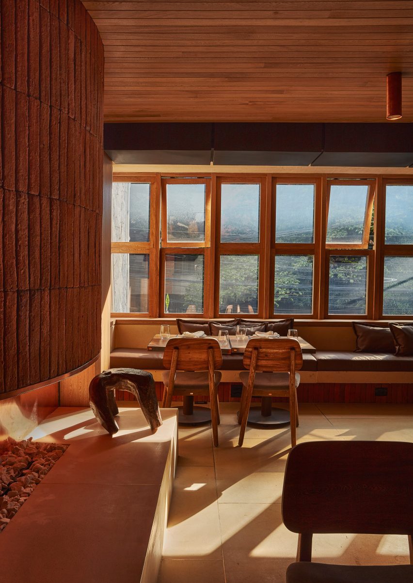 A wall of wood-framed windows in a restaurant
