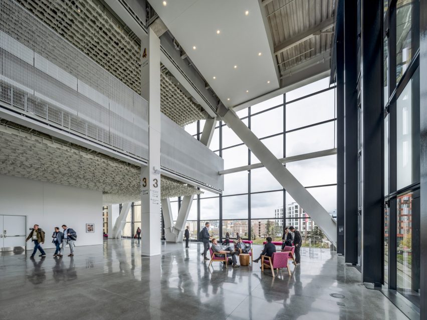 A large lobby area with exposed structural support beams