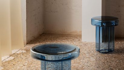 Blue glass tables on terrazzo floor