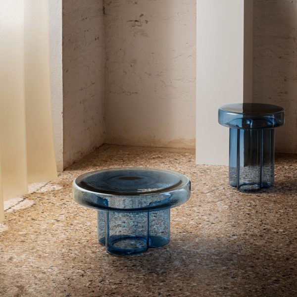 Blue glass tables on terrazzo floor