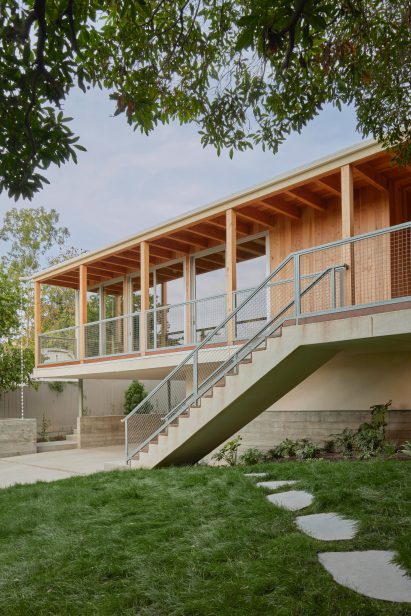 Wood and metal balcony and geometric staircase