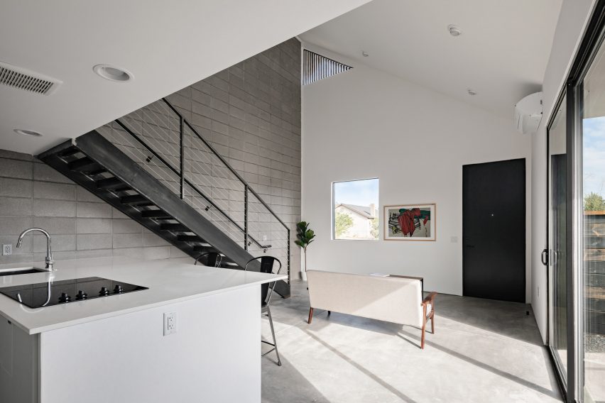 Open-plan kitchen and dining room with a mezzanine level above