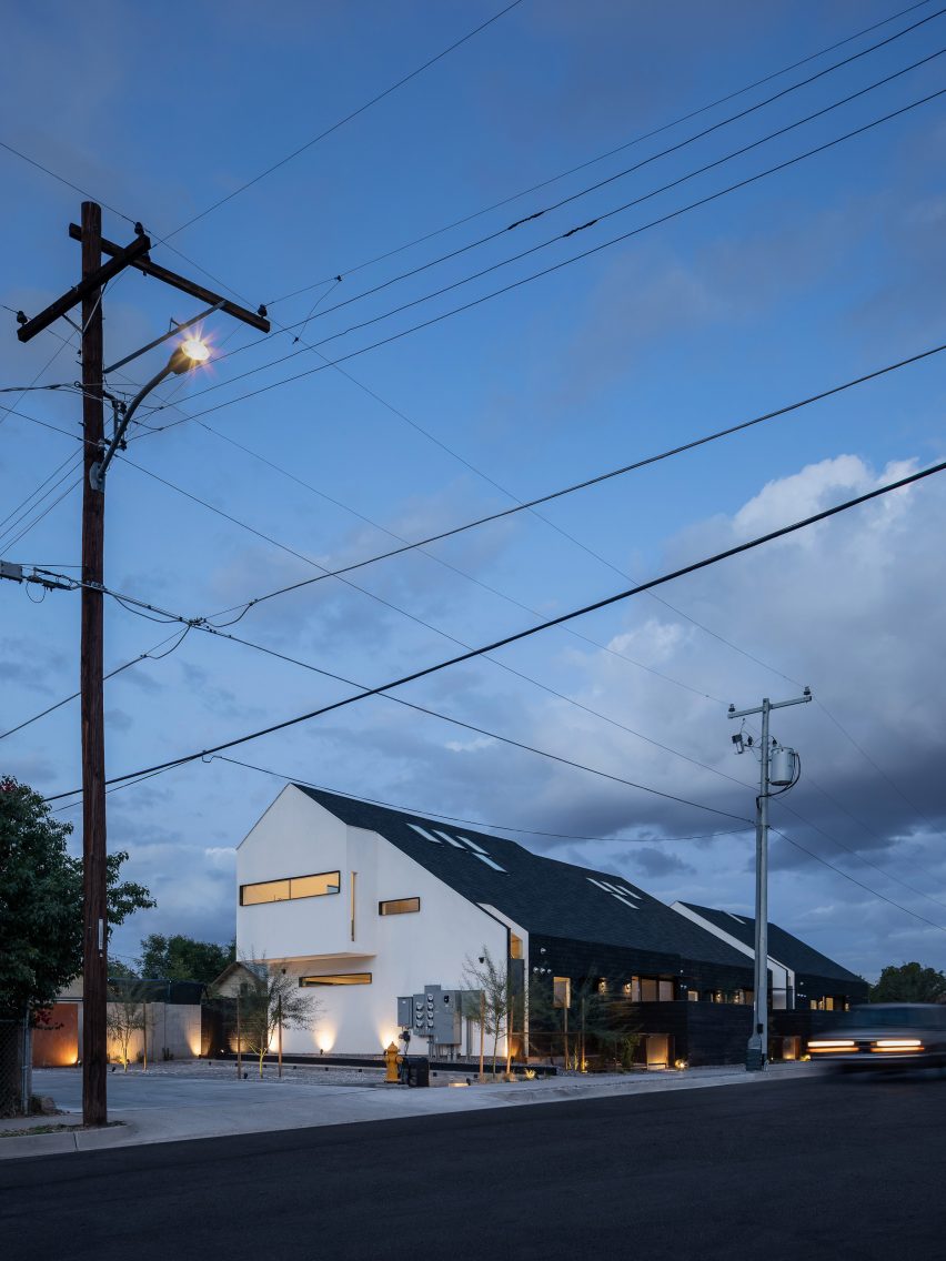 Pitched roof house with extruded upper level and white gable end
