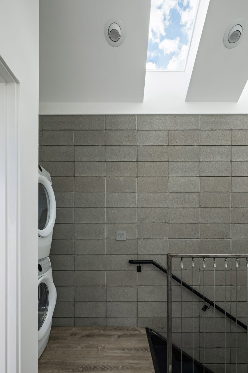 Room with a skylight and concrete block walls