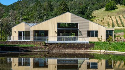 Timber farmhouse barn by a lake by Tyreus Design Studio