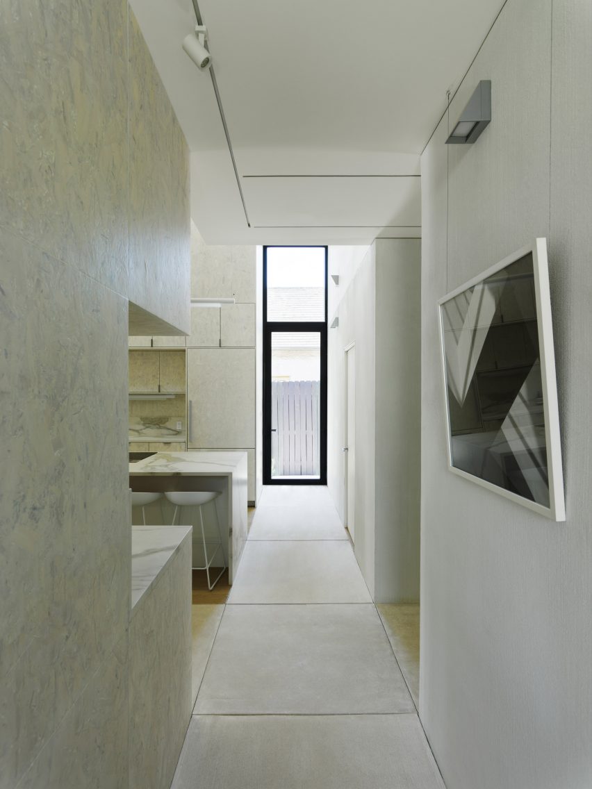 White marble kitchen interior and concrete footpath