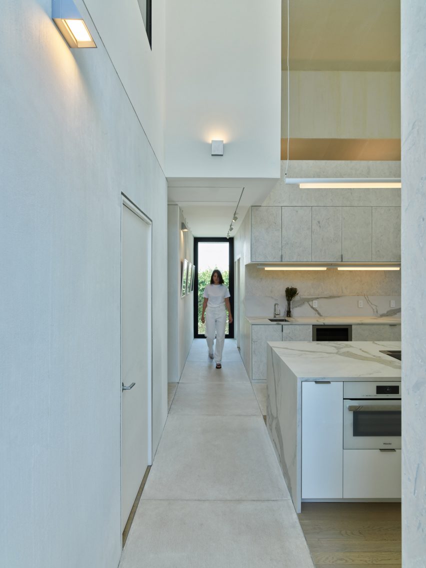 White marble kitchen with a concrete footpath