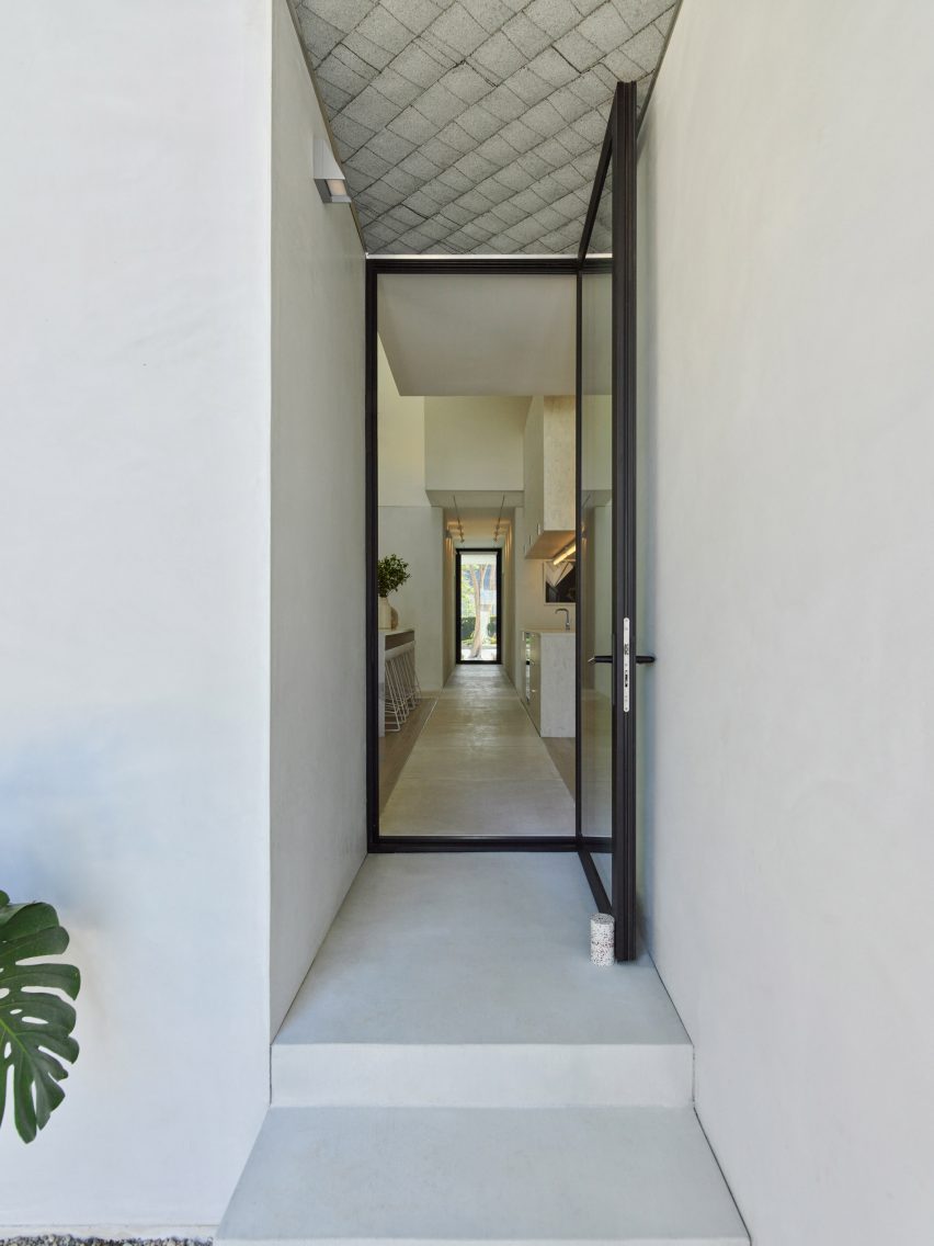 Concrete footpath leading through House 5 by The LADG
