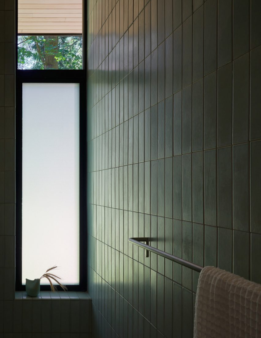 Bathroom with green wall tiles
