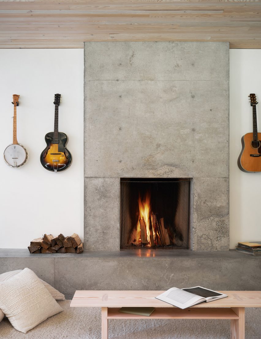 Living room with a concrete fireplace