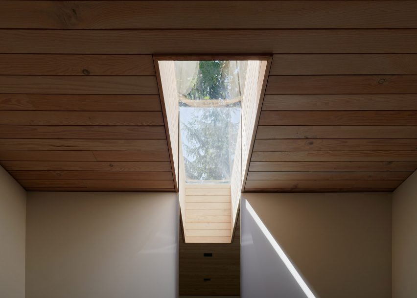 Rectangular skylight in a wood-panelled ceiling