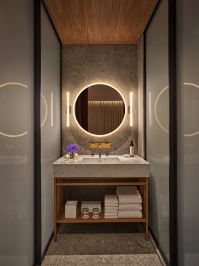 Bathroom with Carrera marble sink and frosted glass panels