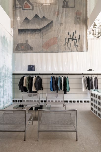 Seating area beside clothing display