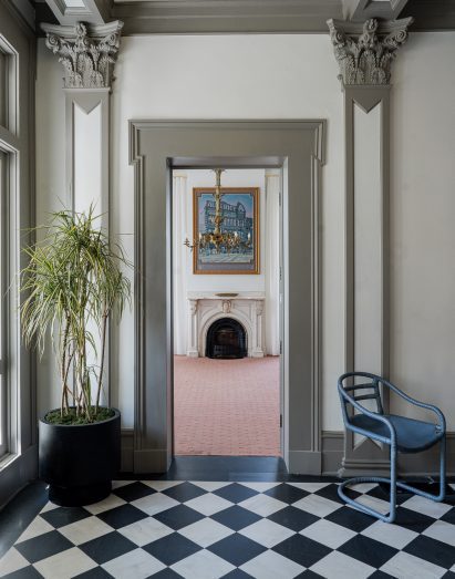 Ornate doorway facing a fireplace