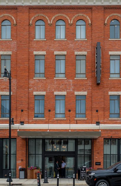 Red brick facade of four-storey warehouse building