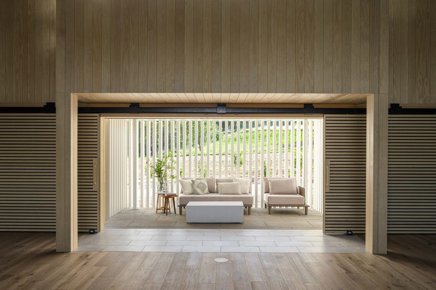 Timber interior with lounge chairs by a window