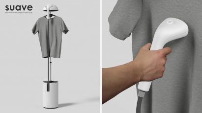 Display of garment hanging on the steamer and a hand holding the steamer against a shirt