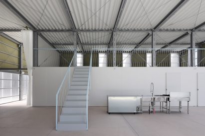 Industrial building with mezzanine and metal staircase