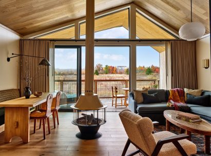 Guest room lounge with sliding glass doors that open onto porch
