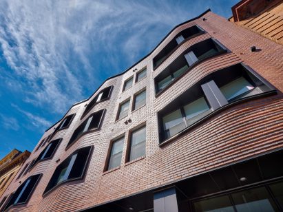 Undulating brick facade