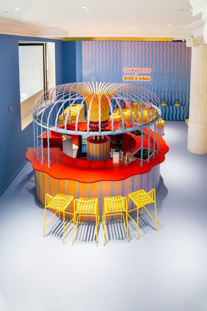 Overhead shot of circular bar inside Courvoisier pop-up bar at Selfridges designed by Yinka Ilori