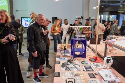 Group of people looking at an exhibition at Central Saint Martins