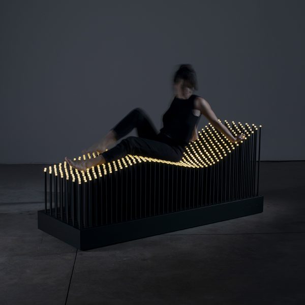 Photo of person sat on the Garlo I Chaise Longue chair by Marina Garlo