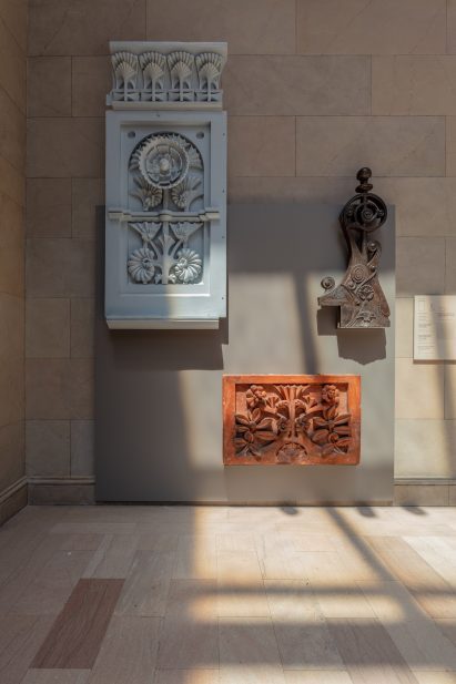 Pieces of buildings attached to a panel