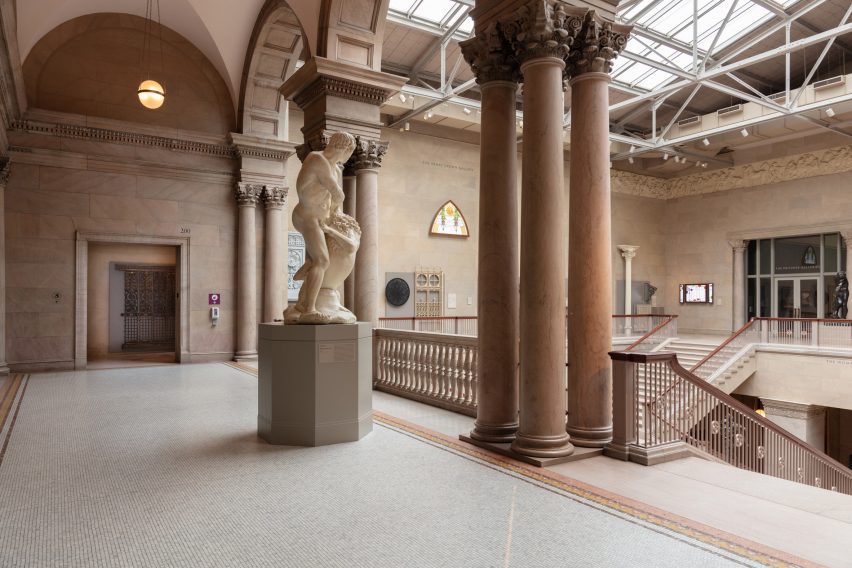 Columns and statue in a large gallery space