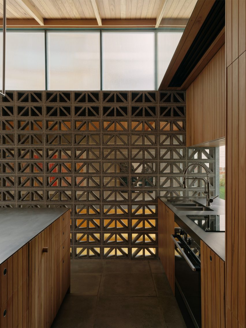 Kitchen interior with wood units and hollow breeze block walls