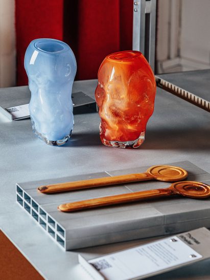 Wooden spoons and colourful glass vases
