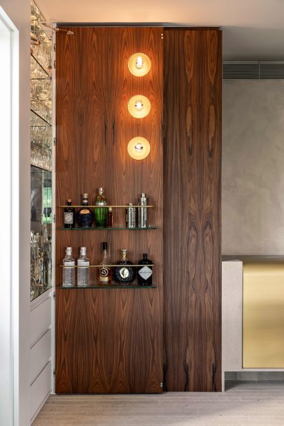 Wood door opened to reveal a hidden bar