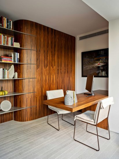 Home office with wood panelling and matching desk