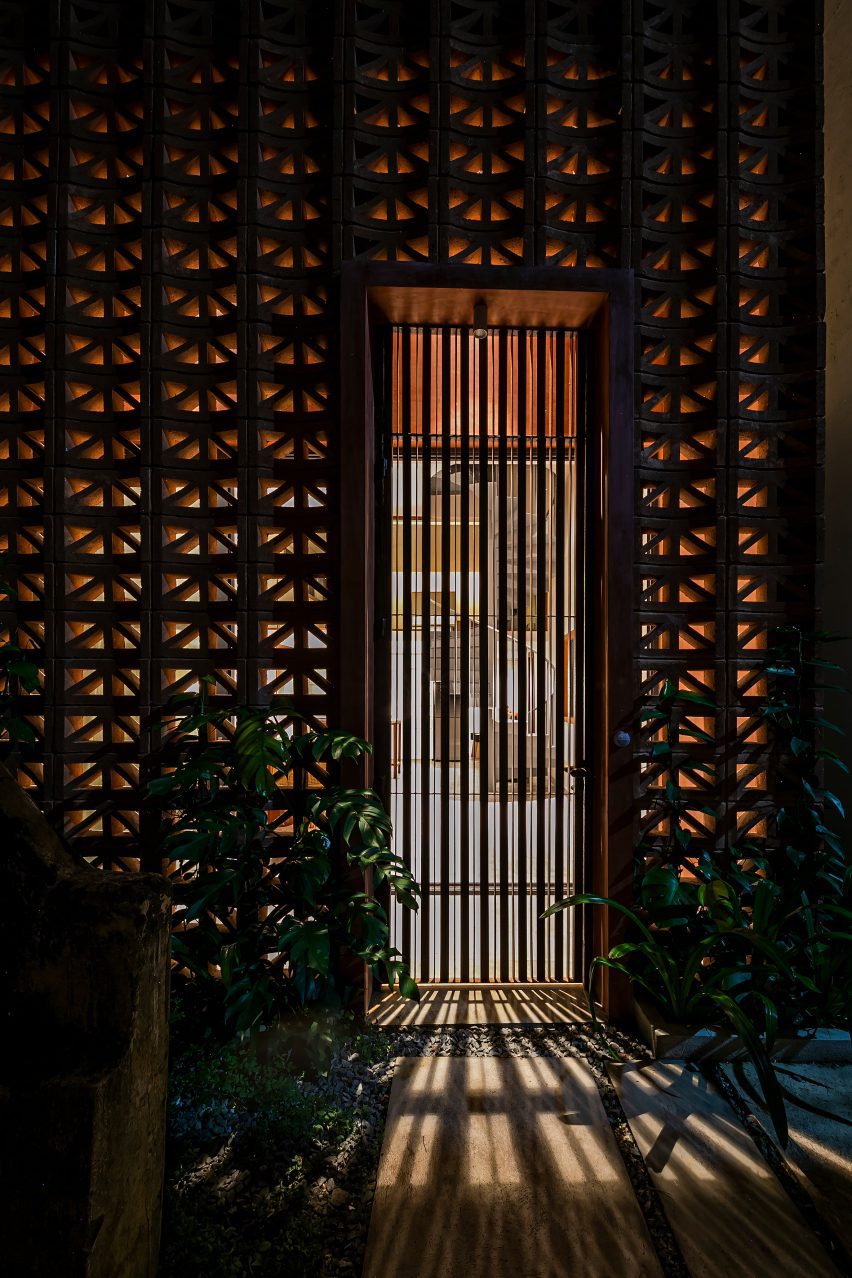 Doorway in a wall made from perforated cement blocks
