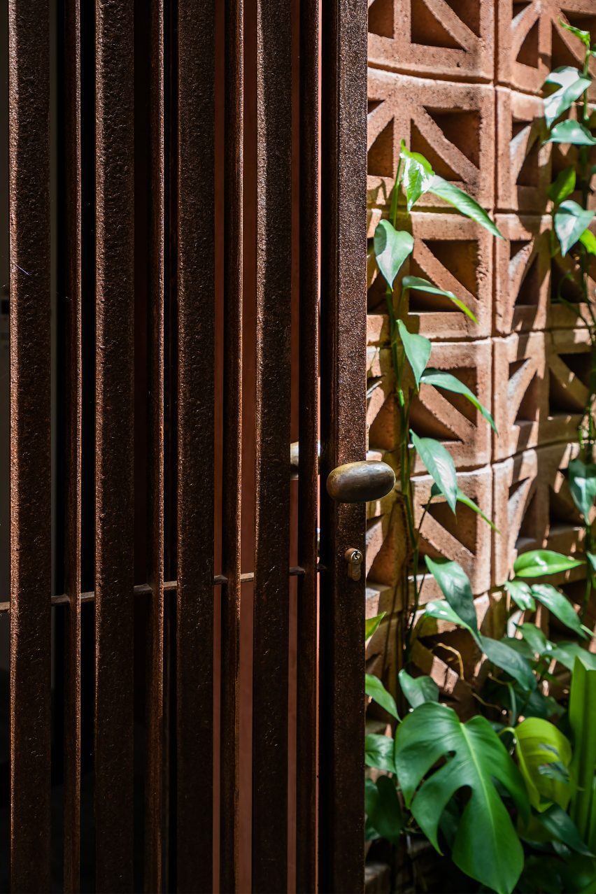 Close-up of a perforated red cement block facade