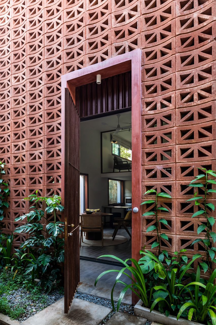 Doorway in a perforated red cement block building