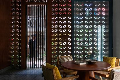 Internal dining area with perforated cement block walls letting in daylight