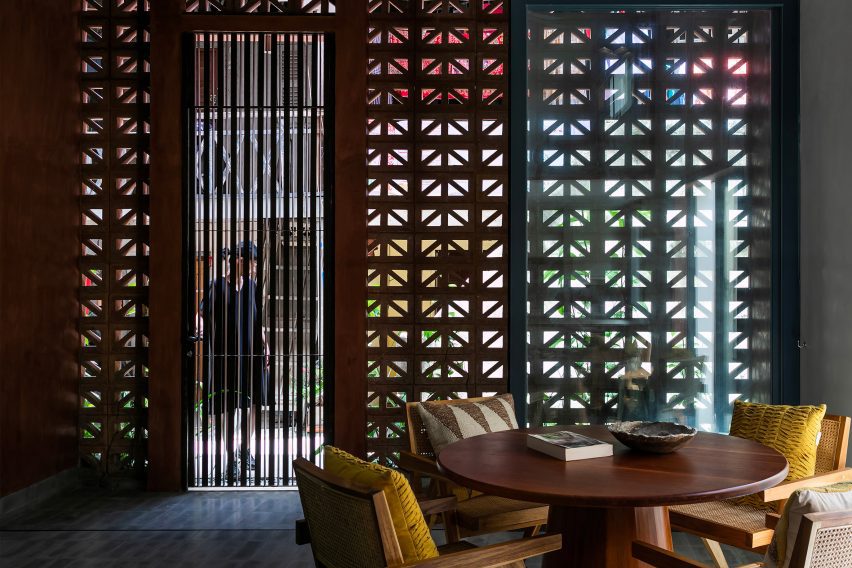 Internal dining area with perforated cement block walls letting in daylight