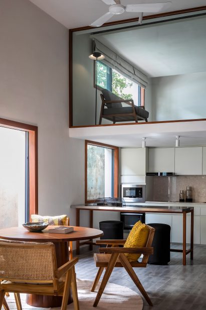 Double-height kitchen and dining room with a mezzanine
