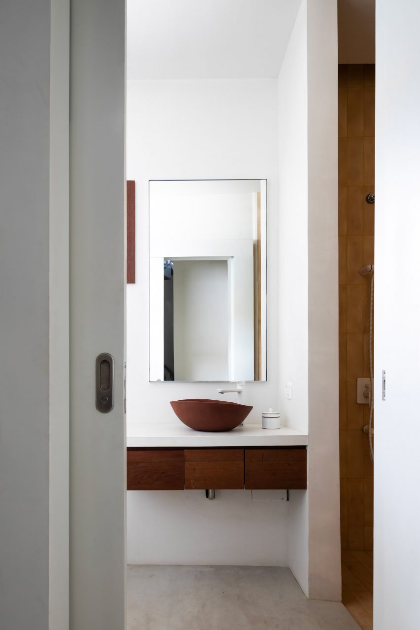 White bathroom interior with wood floating vanity unit
