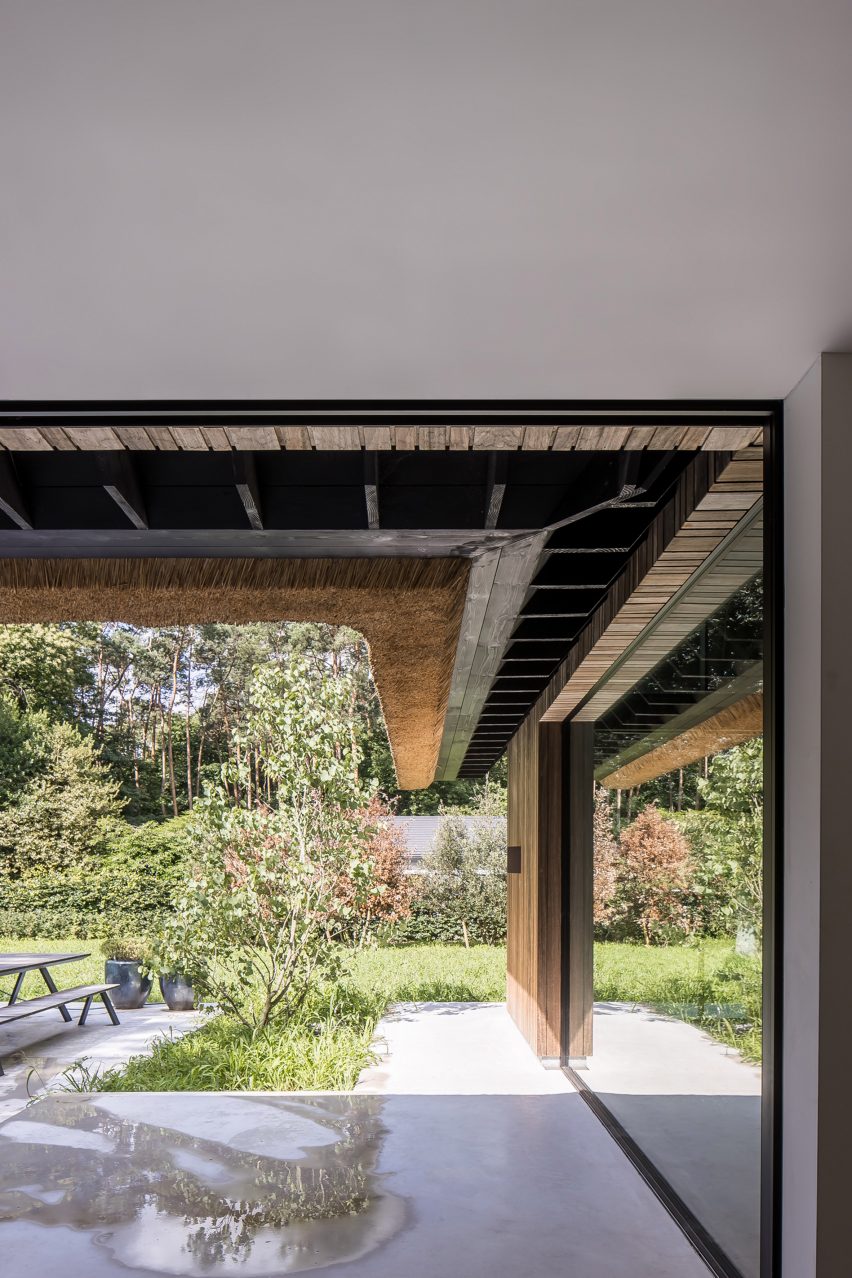 Open glass walls at Villa VD leading to a terrace in a garden