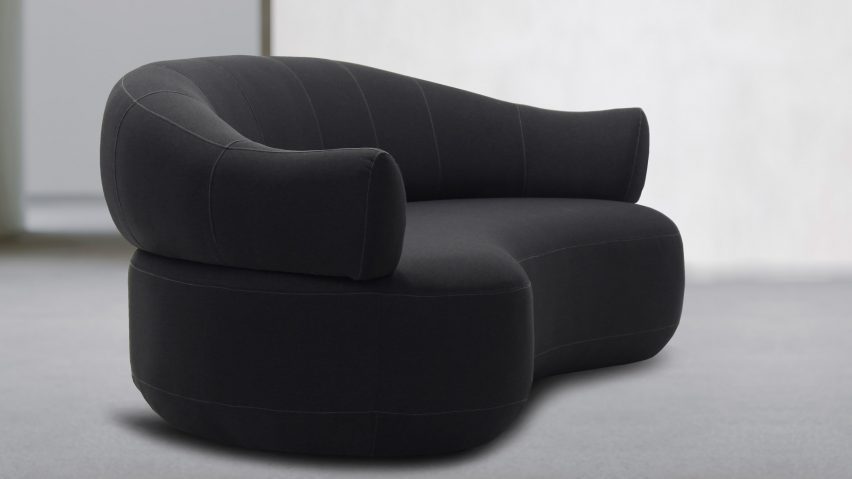 Dark grey sofa in white room