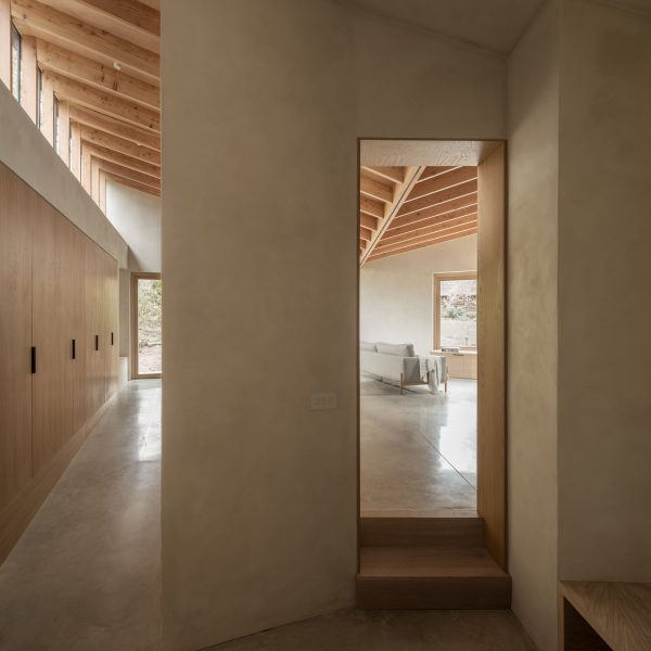 Hallway of Butterfly House by Oliver Leech Architects