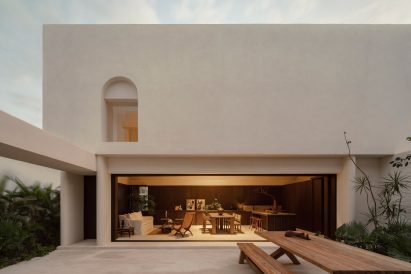 Minimalist house with ground floor that opens to a courtyard