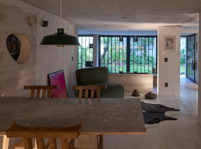 A view into a garden across a dining table