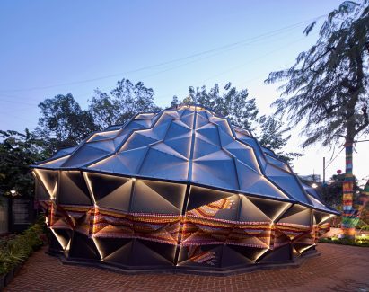 Andblack Design Studio black metal tent lit up at night
