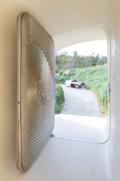 Metal door with grooves