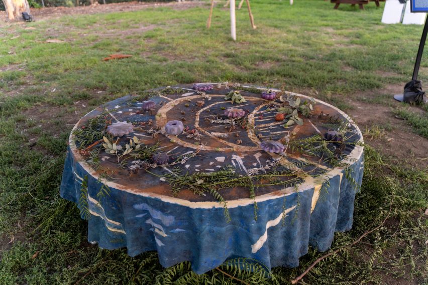 A circular table with plants and other memorabilia